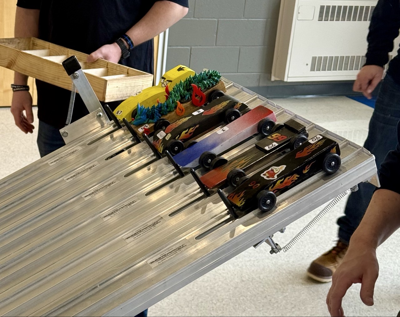 Pinewood Derby cars racing